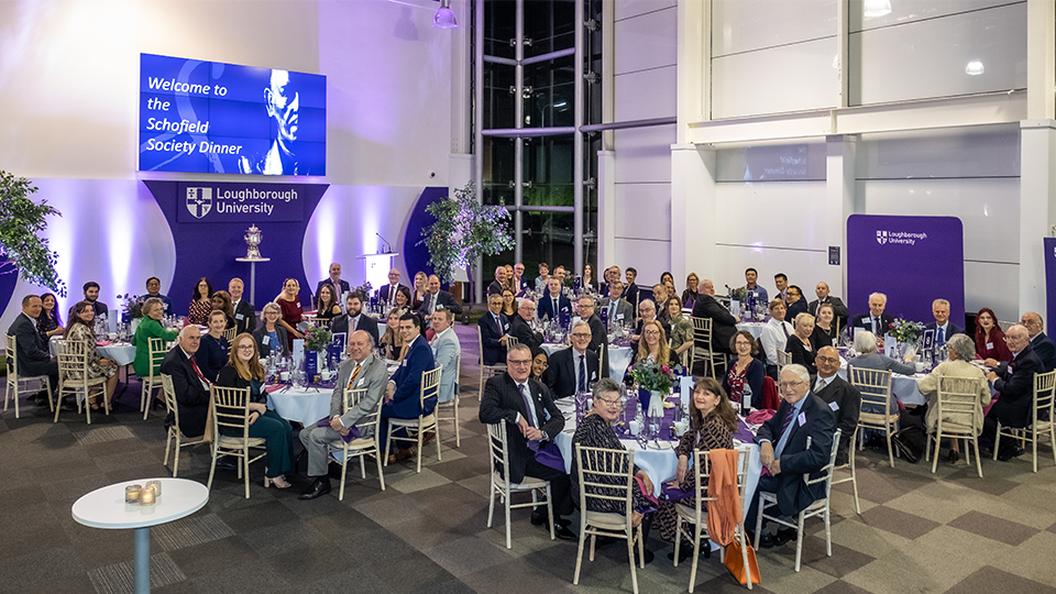 A room of people seated at tables