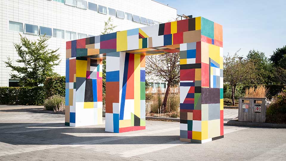 Brightly coloured wooden archway