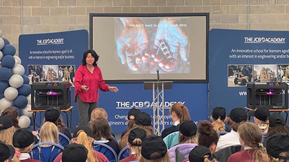 Speaker giving a lecture to children from The JCB Academy