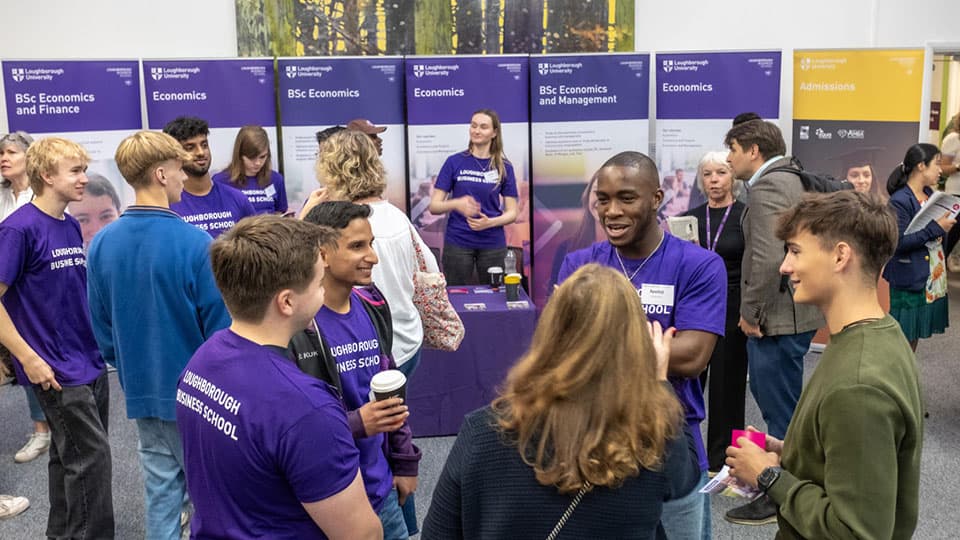 Students and staff chatting at an Open Day.