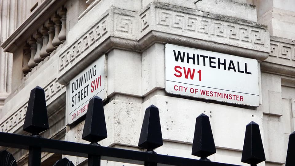 Exterior building signage in Whitehall, City of Westminster.