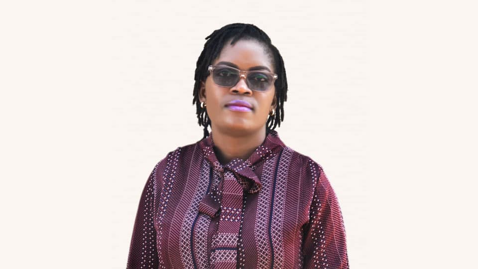 Headshot of Joyce, a PhD student up against a white background. 