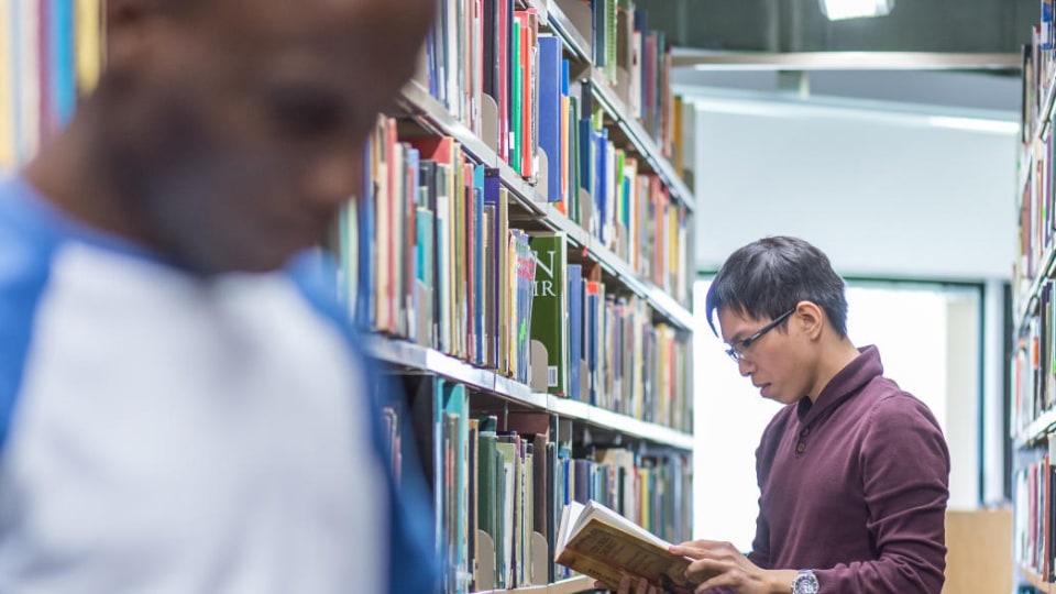 Students looking at books