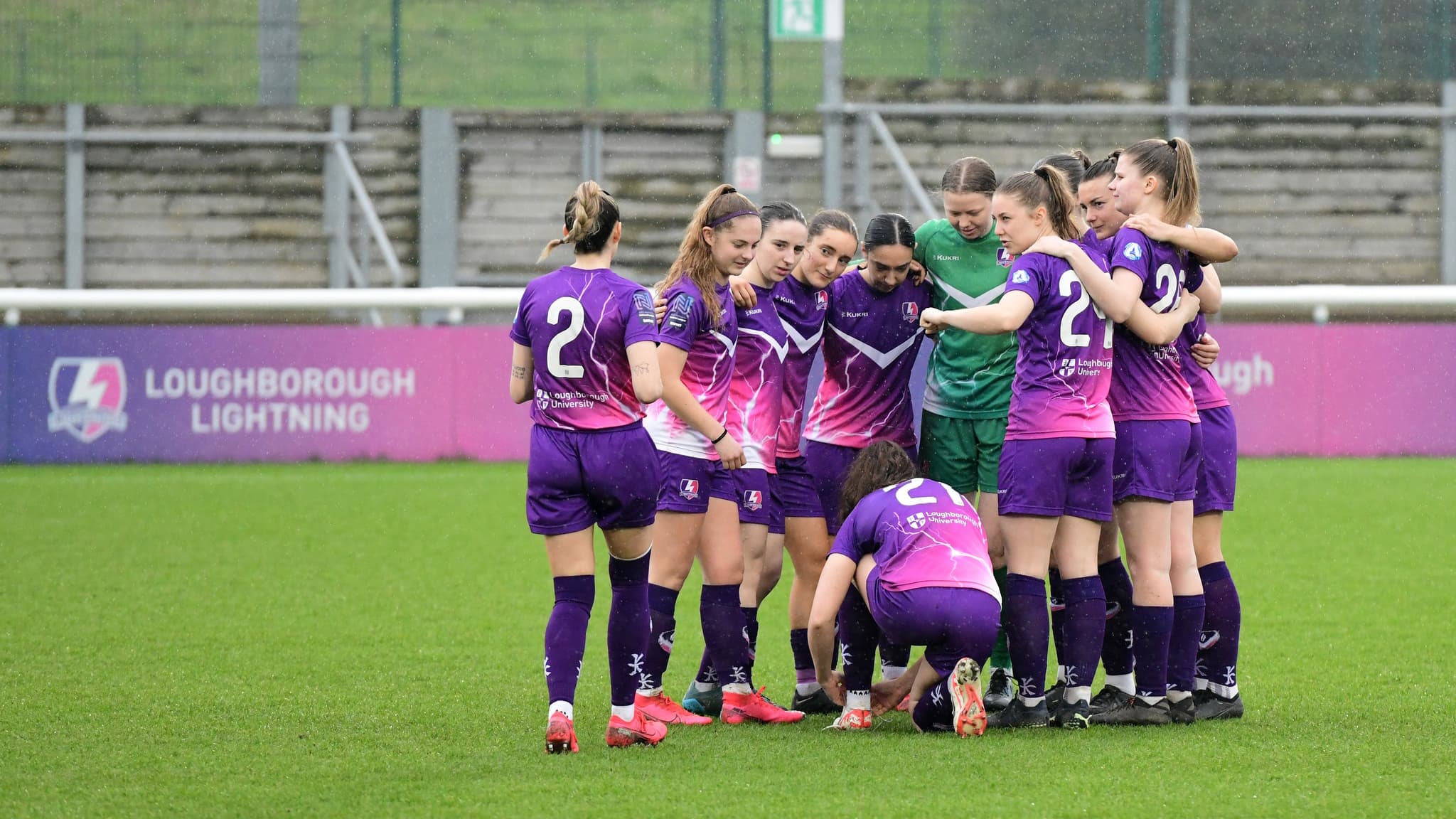 Loughborough Lightning football players mid game on the pitch