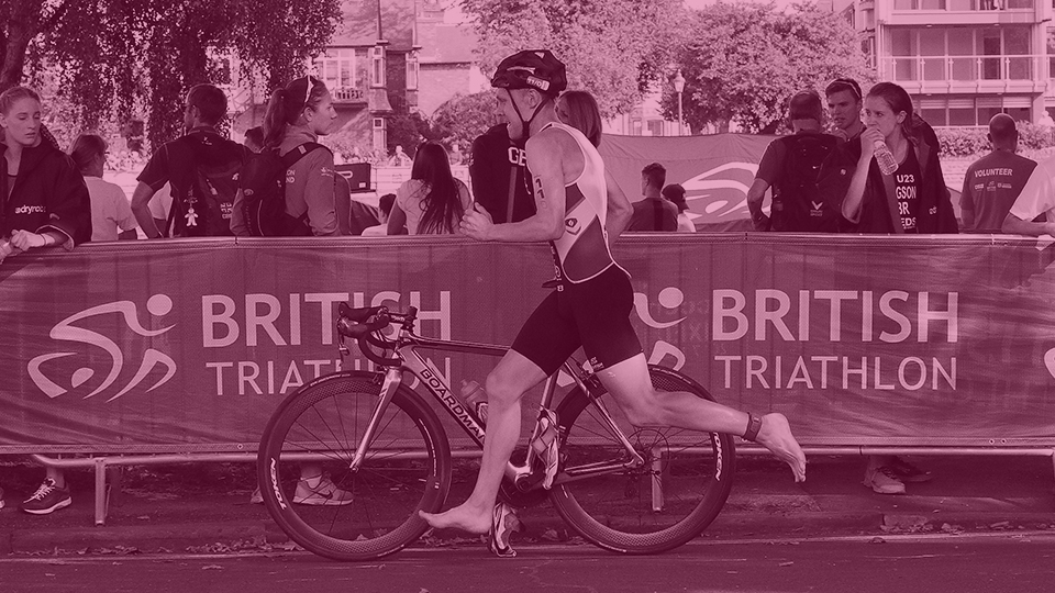 a triathlete next to his bike