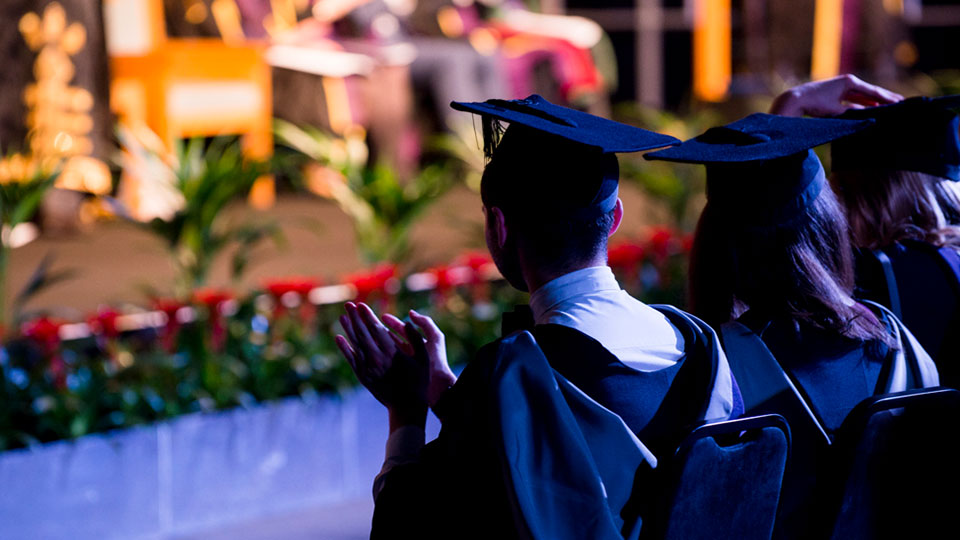 A graduate at the Loughborough University London graduation ceremony.