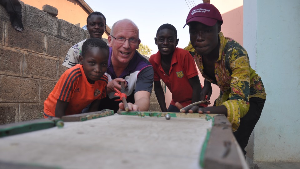 Vice Chancellor Professor Robert Allison interacting with youngsters in Zambia