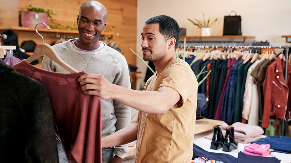 Men checking what a top is made of. 