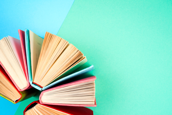 Books on a light blue background. 