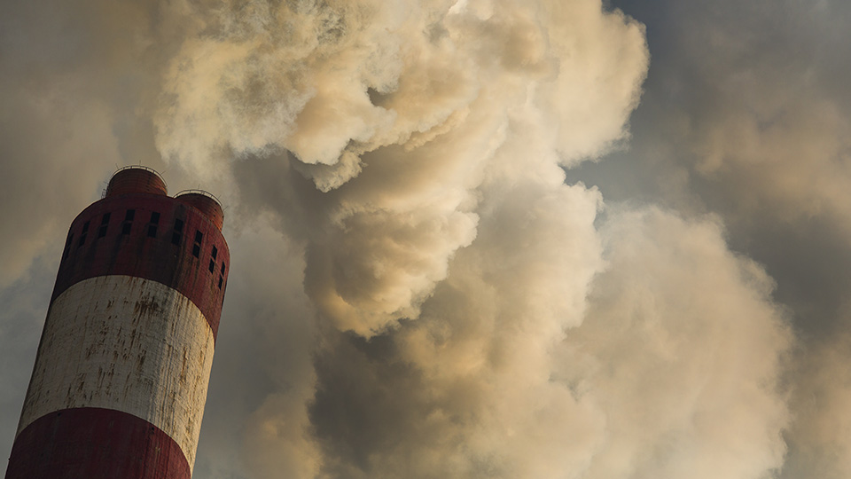 Air pollution coming from a chimney 