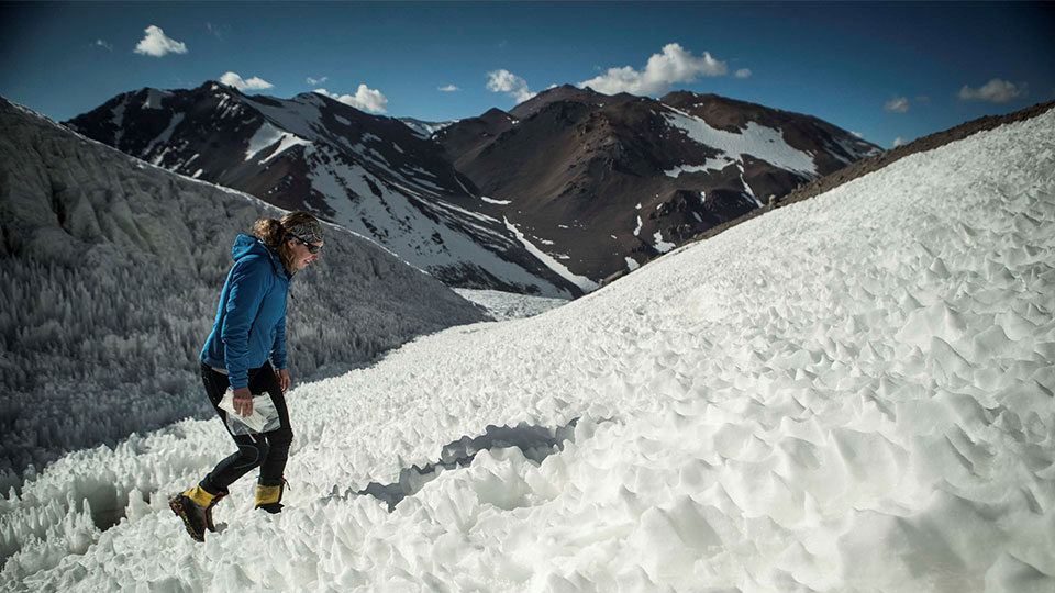 Suzanne climbing a snowy mountain