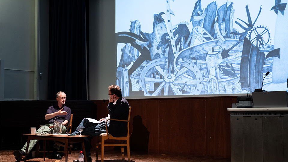 Pictured is Michael Landy in discussion with Professor Craig Richardson.