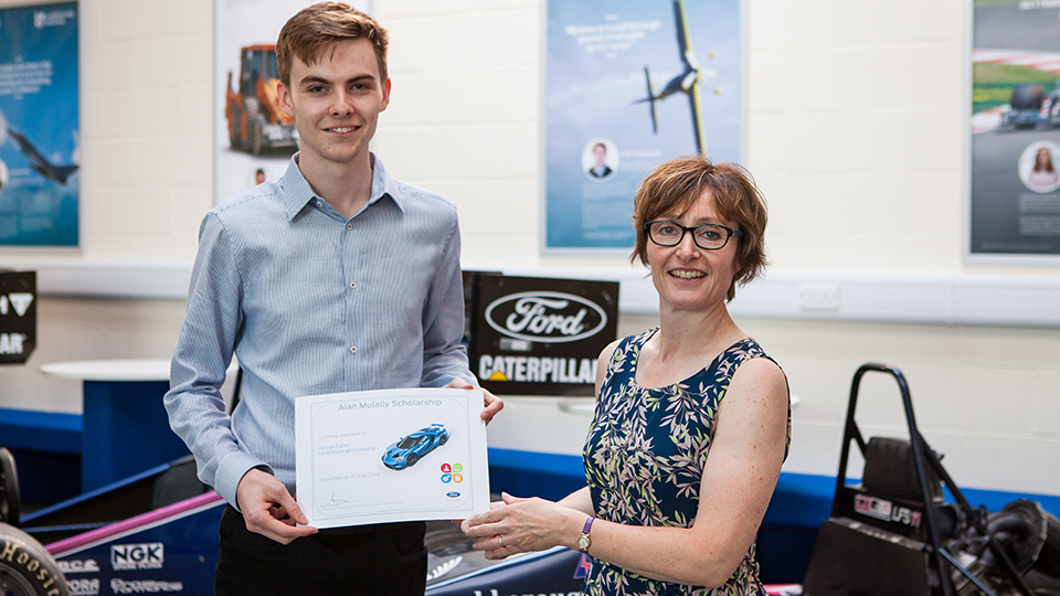 George Carter receiving a certificate from Angela Morley