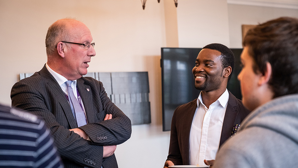 photo of Robert Allison and a scholarship student, Michael, at the presentation event