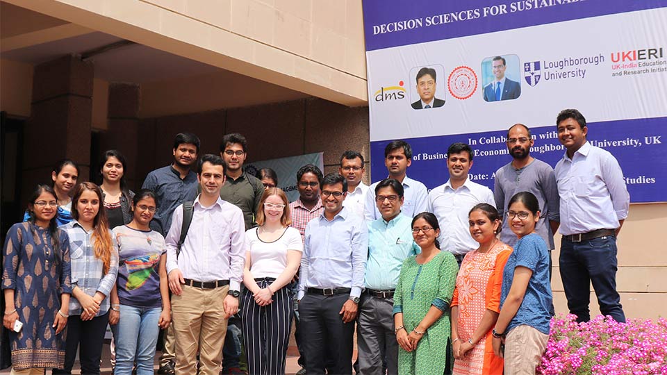 Pictured fourth to the right is Professor Ravi Shankar with Dr Alok Choudhary to his left. 