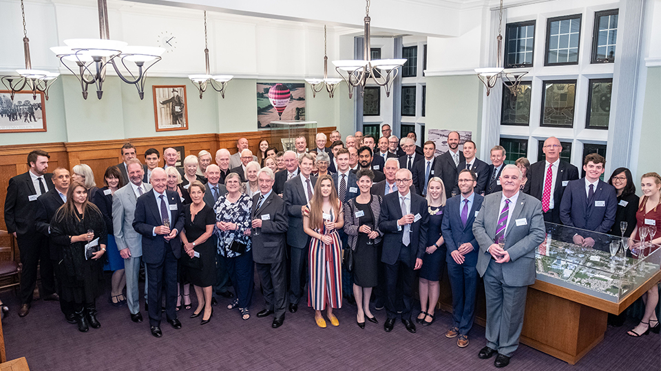 photo of Schofield Society members with members of staff and students from the University