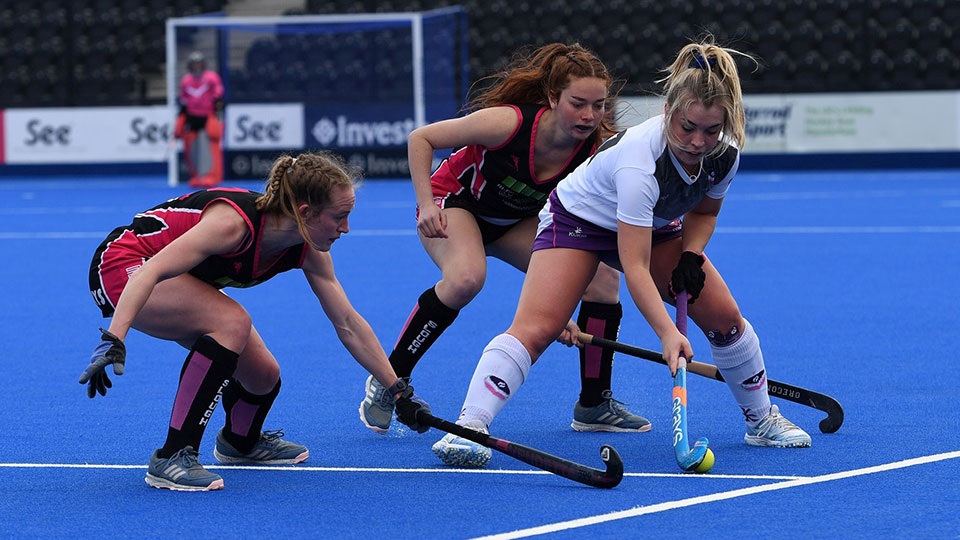 3 hockey players during a European Hockey Championship match