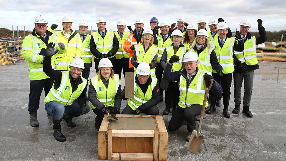 Photo of staff outside frame of building at LUSEP