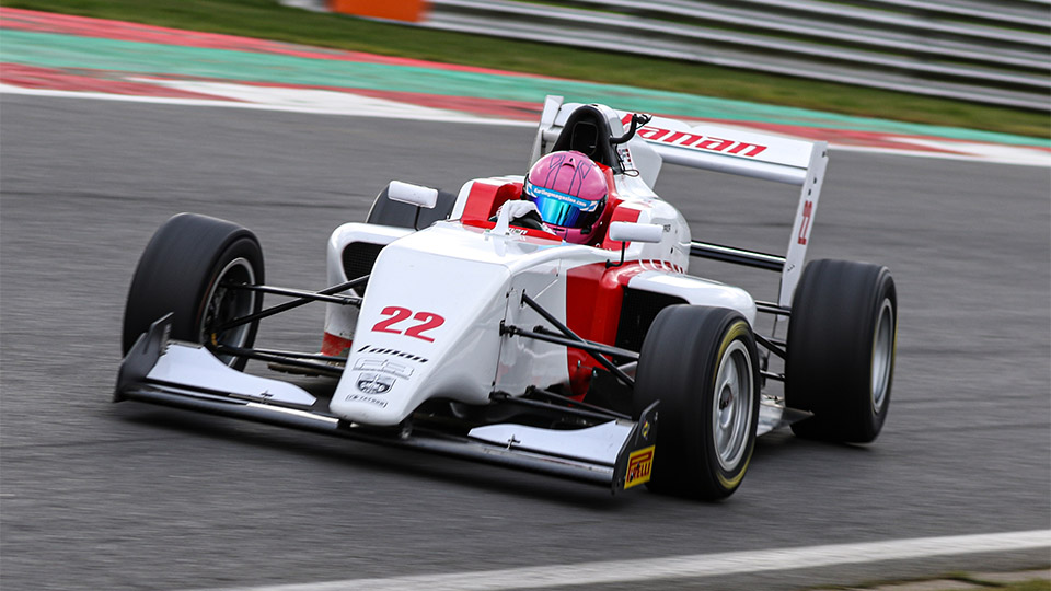 photo of Piers sat in racing car on track