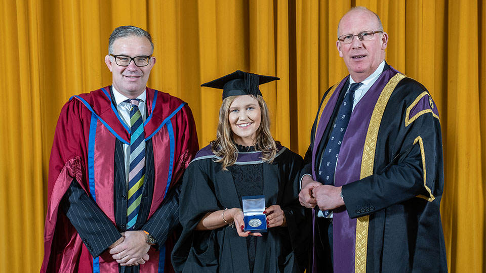 Photo of a previous recipient of a University Prize with Professor Robert Allison