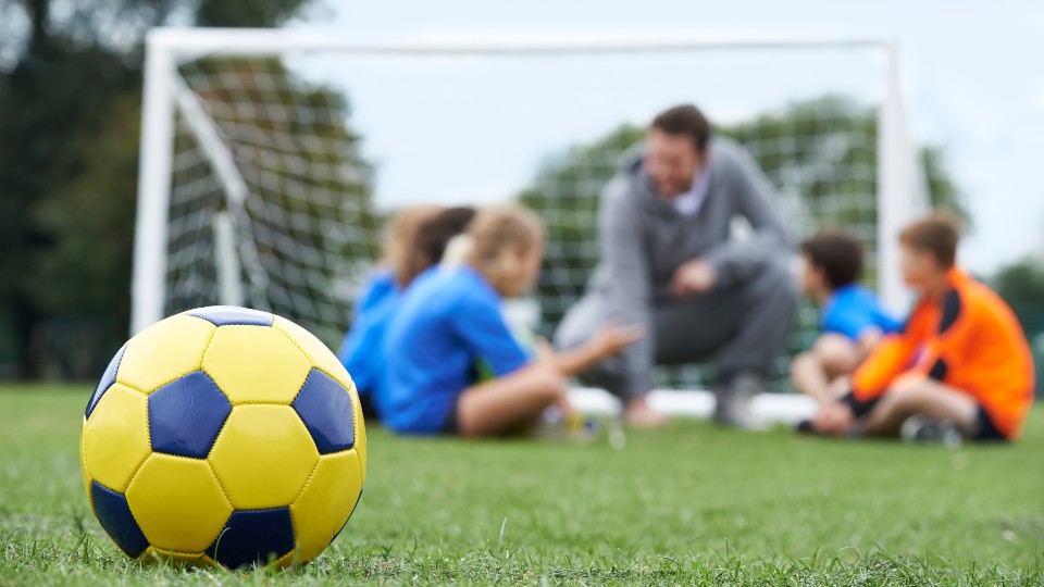 A posed shot of children playing sport 