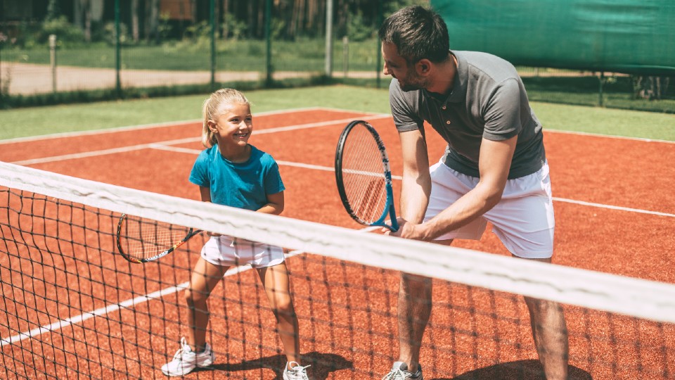 two people playing tennis