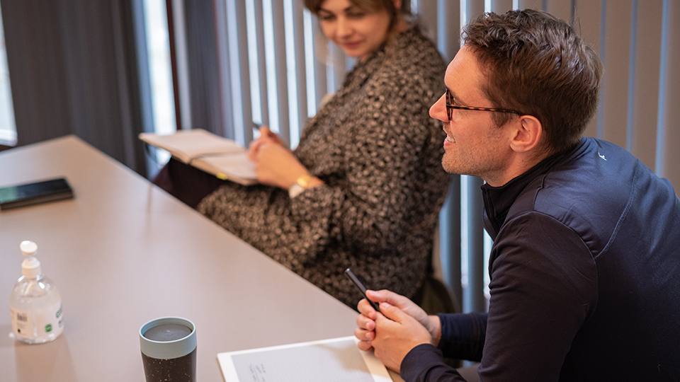 Image of two people interviewing