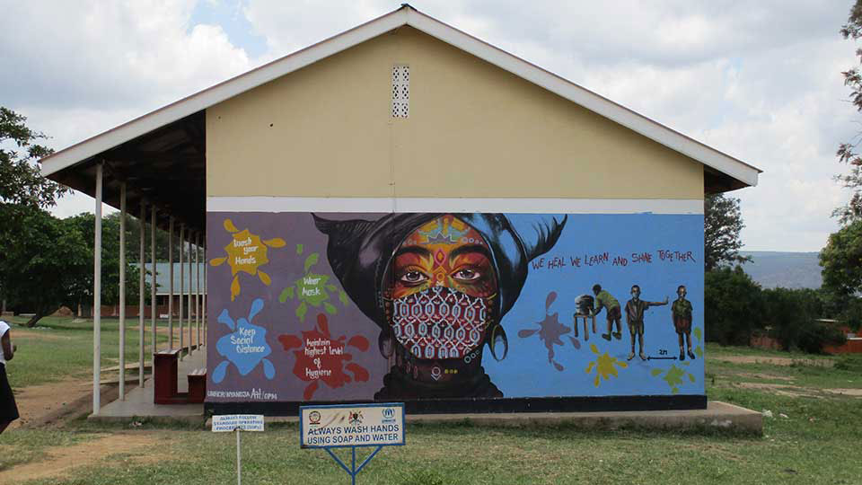 Painting of a woman on the side of a building