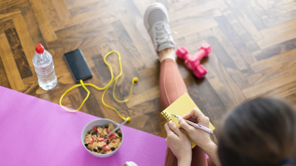 A stock image of a woman taking notes.