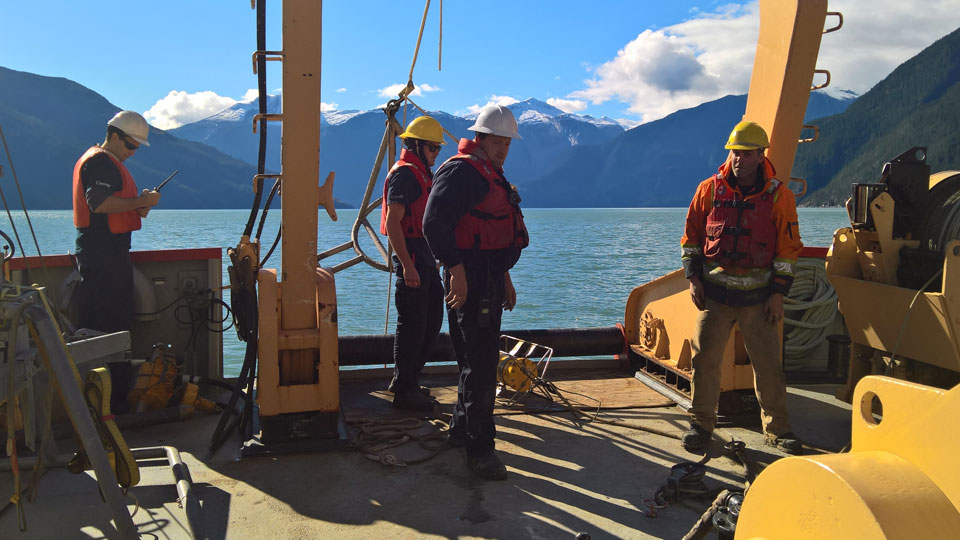 The researchers on the deck of the research vessel, Vector