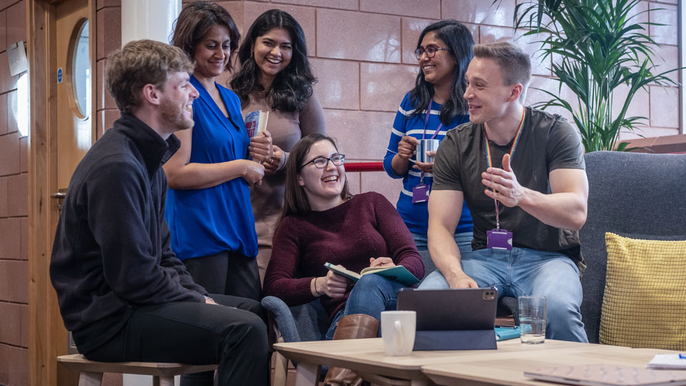 LUinc. members – some of whom will be appearing at events during the Festival - sitting and chatting round a coffee table