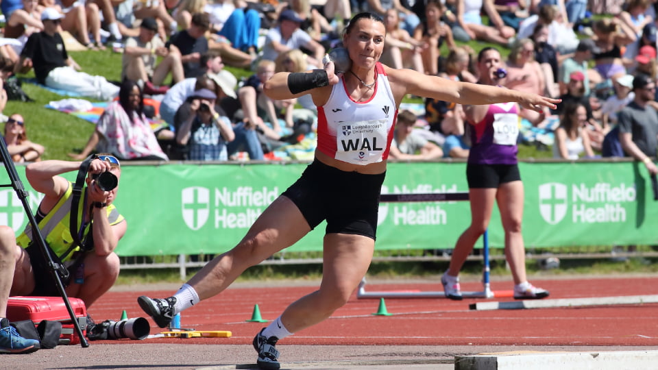 Adelé Nicoll throwing a shot put