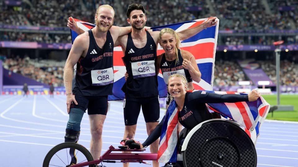 Great Britain's Jonnie Peacock, Zachary Shaw, Ali Smith and Samantha Kinghorn celebrate silver in the 4x100m Universal Relay Final at the Stade de France