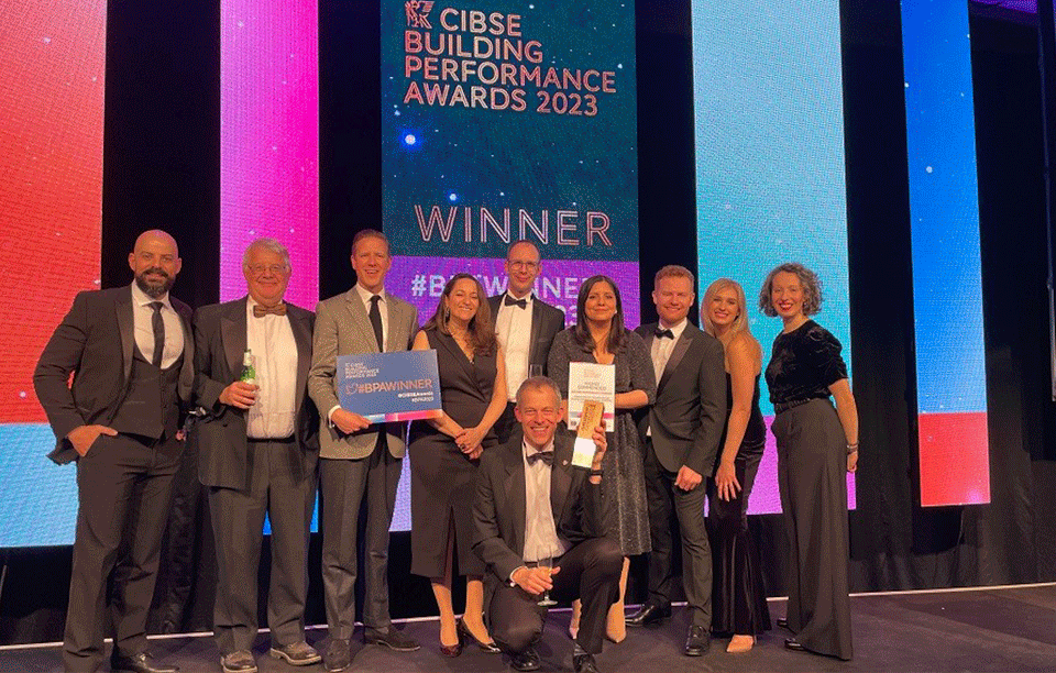 A photo of Professor Malcolm Cook and the AIRBODS team receiving their award at the CIBSE awards ceremony.