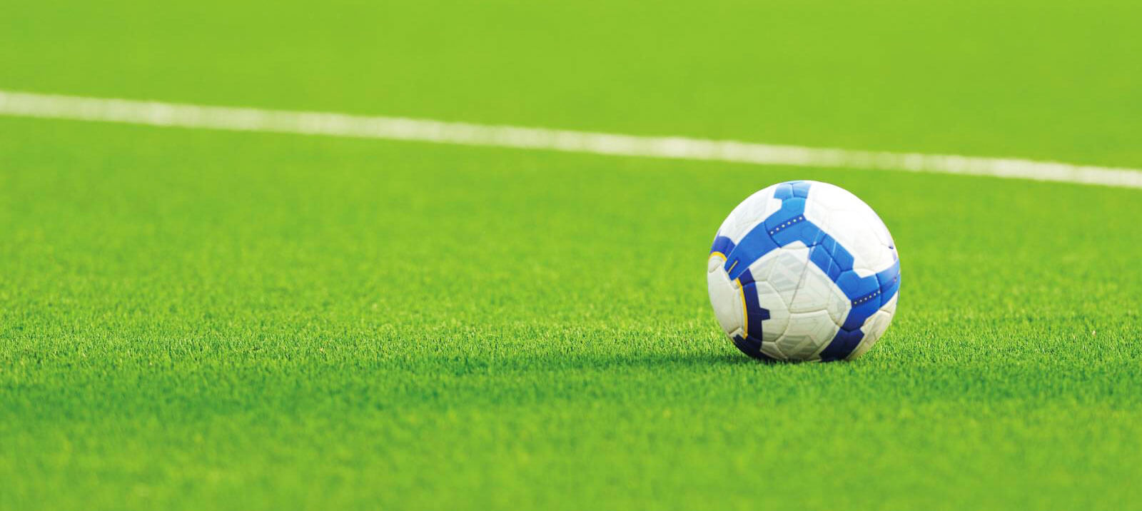 A close up of a football on grass