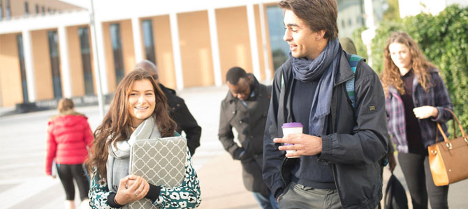 Students walking and talking in Shirley Pearce Square