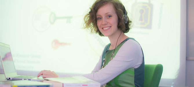 Researcher turning to face the camera with a smile