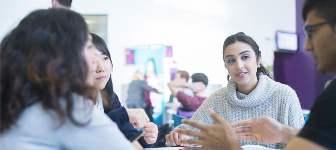 Group of four students in discussion