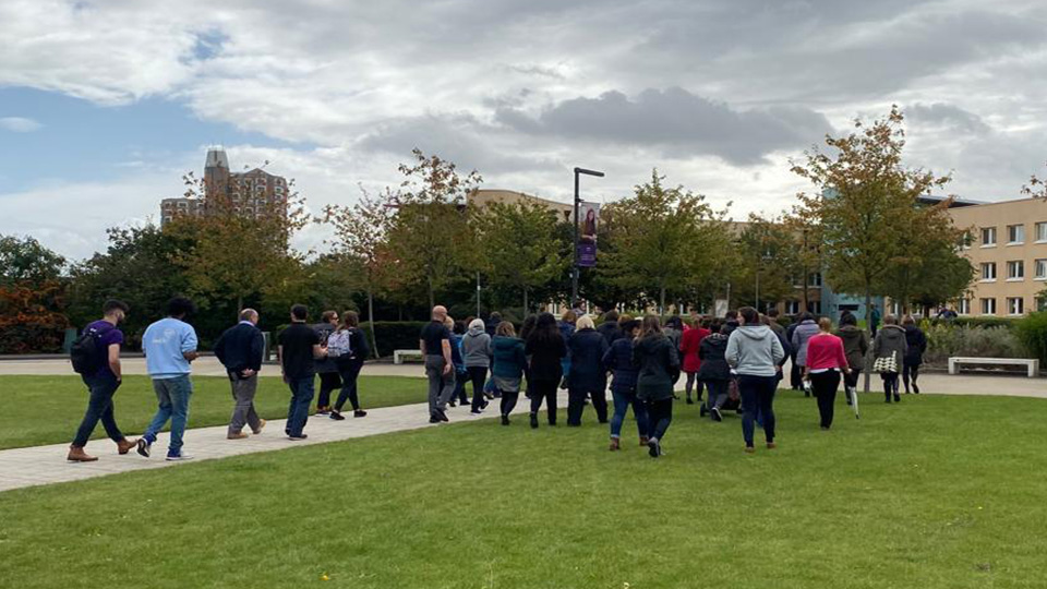 photo of staff and students on the walk